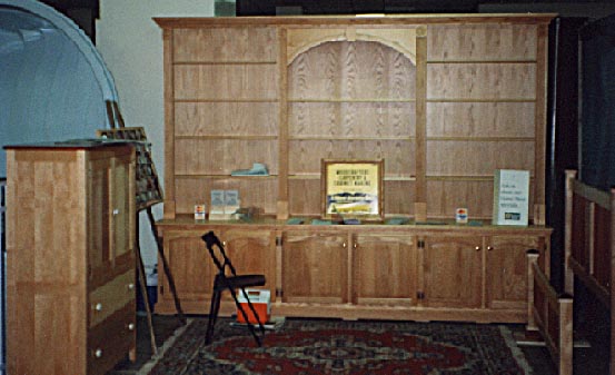 Birdseye maple and rosewood armoire, Pickled oak wall unit, Curly maple and rosewood bed